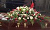 Red Rose and White Carnation Casket Flowers with Tropical Leaves