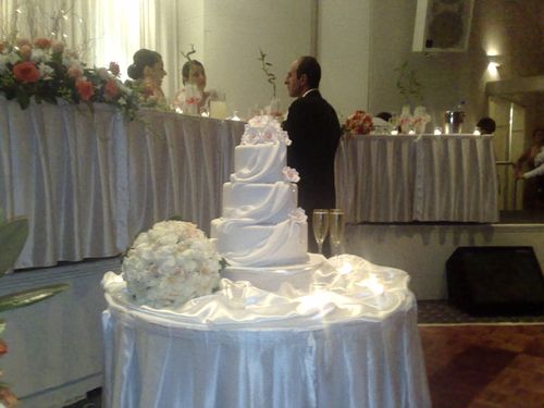 Bridal Bouquet Displayed on Wedding Cake Table